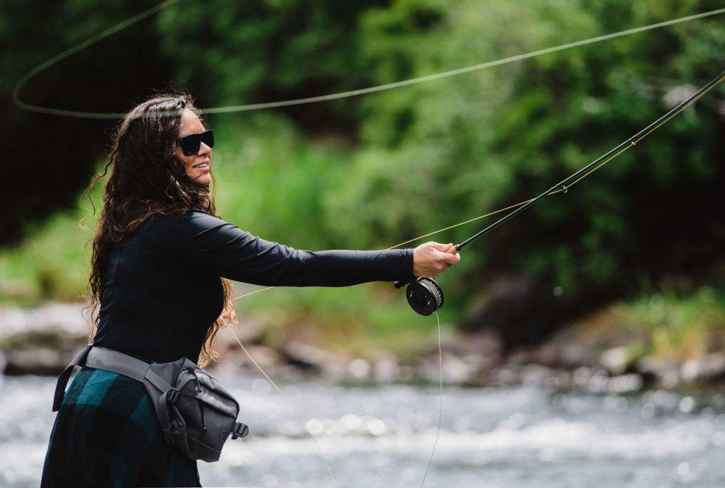 Cheryl Valdez fly fishing the Deschutes river during the salmon fly hatch. 